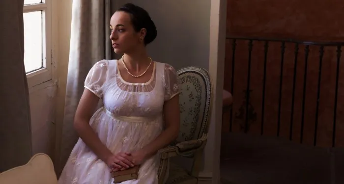 a woman in regency dress